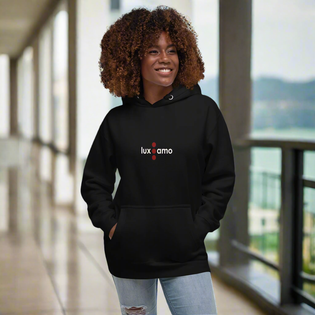 Person wearing a black hoodie with 'luxamo' logo