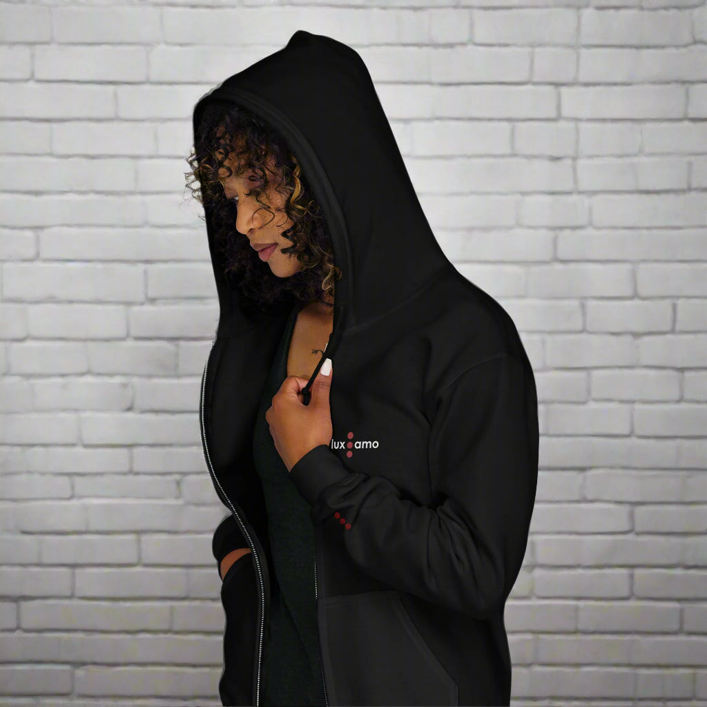 Person wearing a black hoodie with a brand logo on a white background