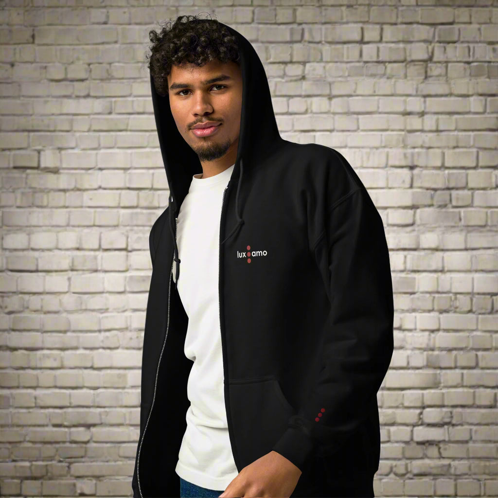Person wearing a black hoodie with a visible brand logo on a white background