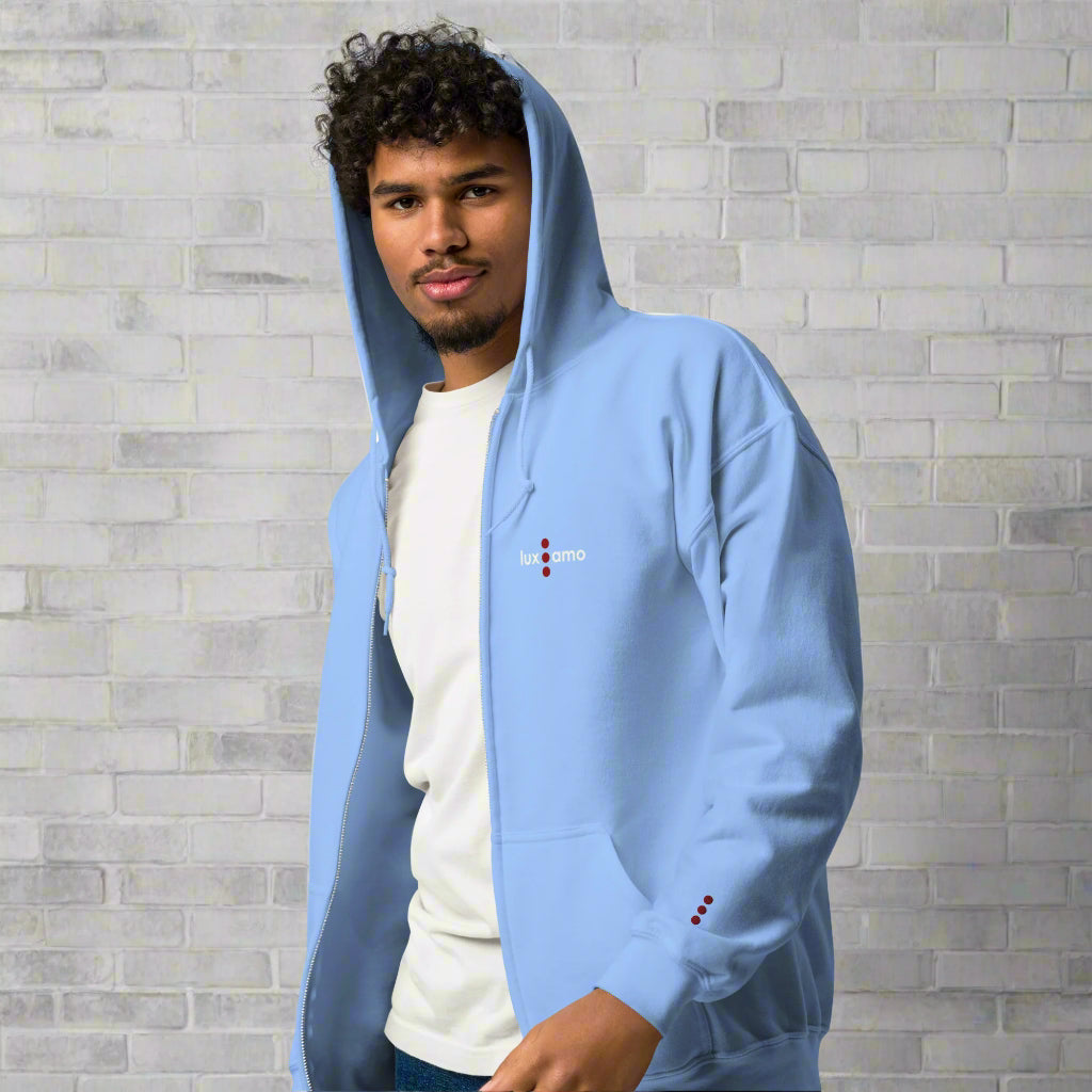 Person wearing a light blue hoodie with a brand logo on a white background