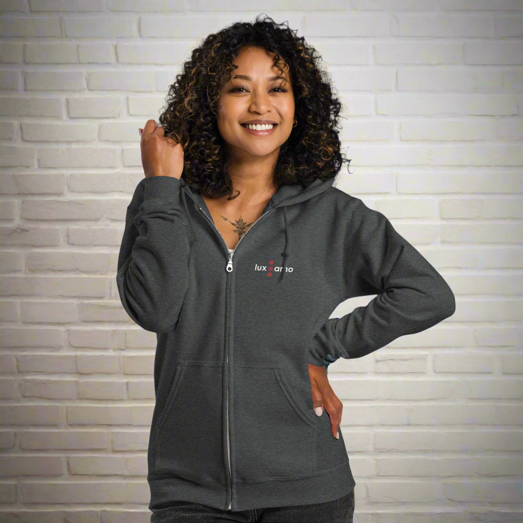 Woman wearing a gray hoodie with a logo on a white background