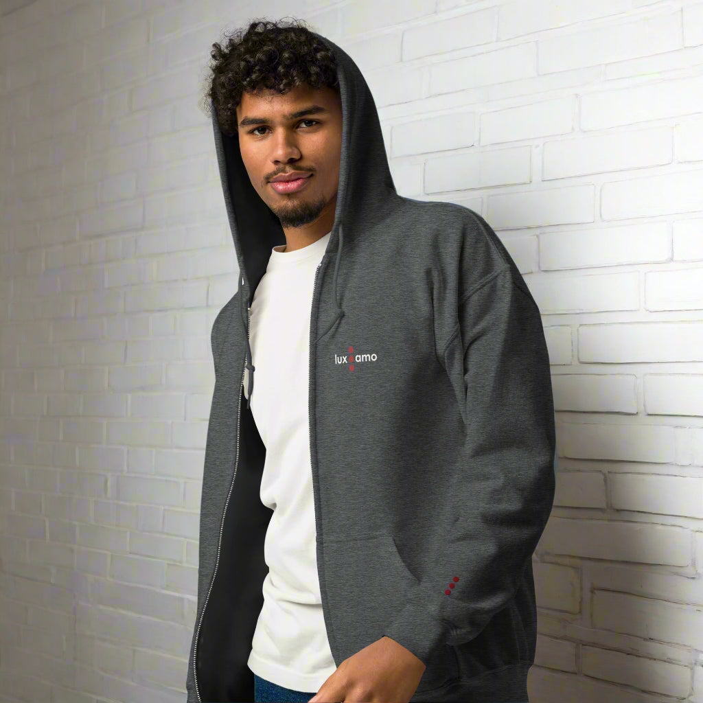 Person wearing a gray hoodie with a brand logo on a white background