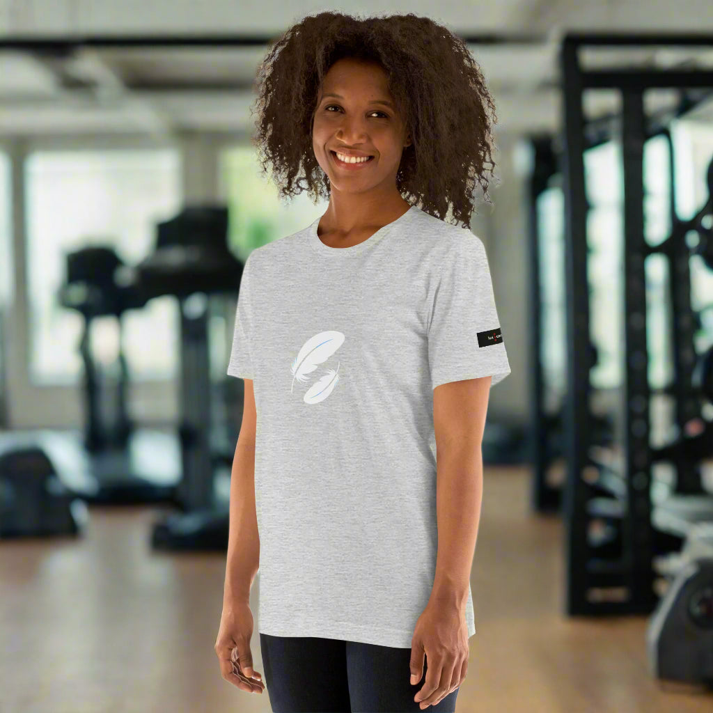 Woman wearing a gray t-shirt with a logo in a gym setting