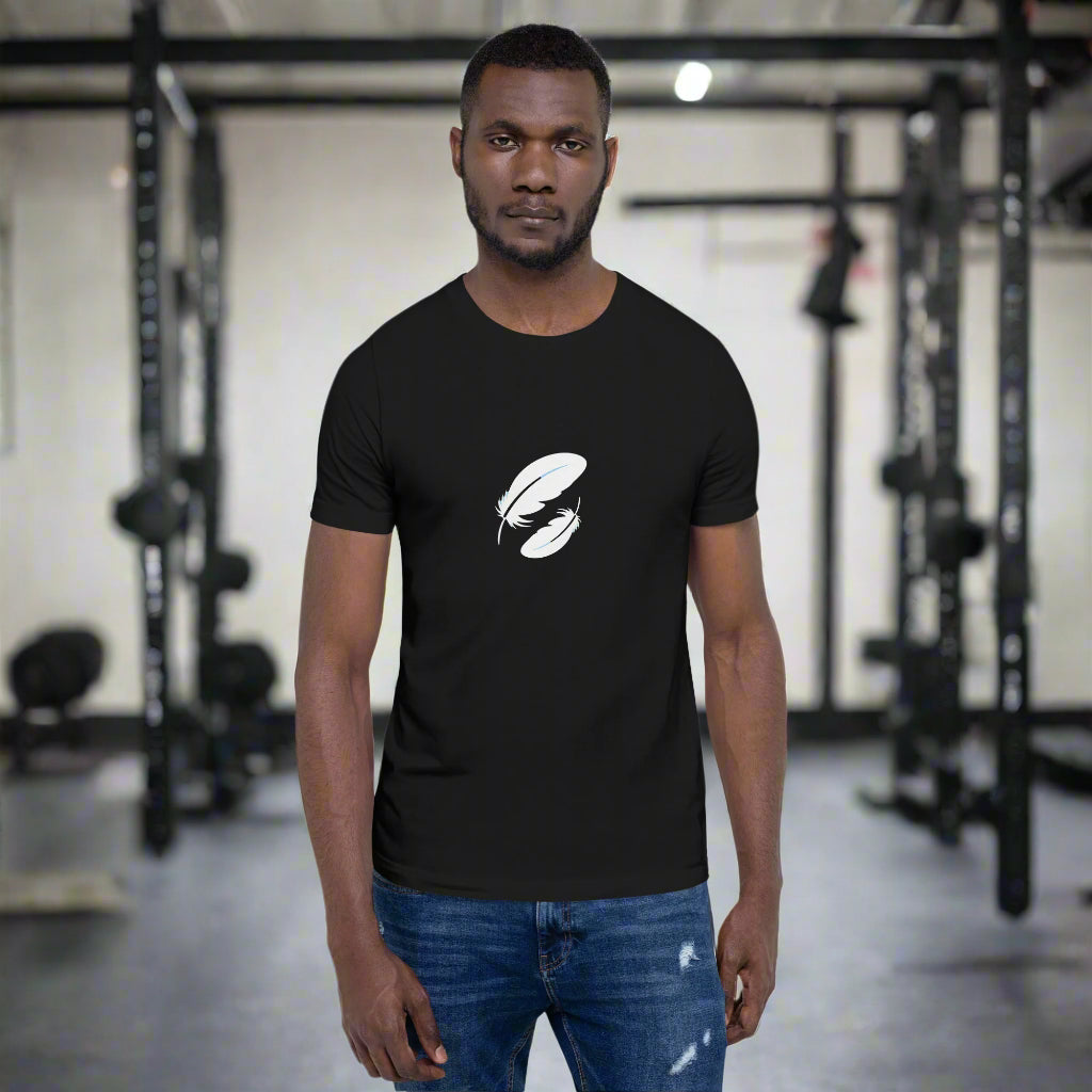 Man wearing a black t-shirt with a white logo in a gym setting